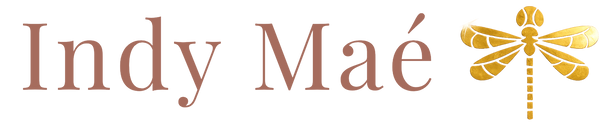 Logo of Indy Maé with a gold dragonfly on a transparent background